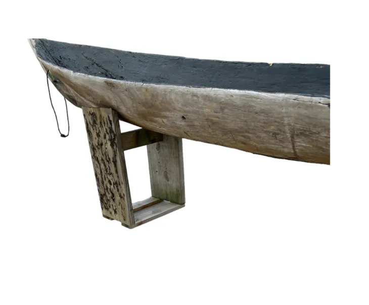 Early Wooden Canoe on Stands